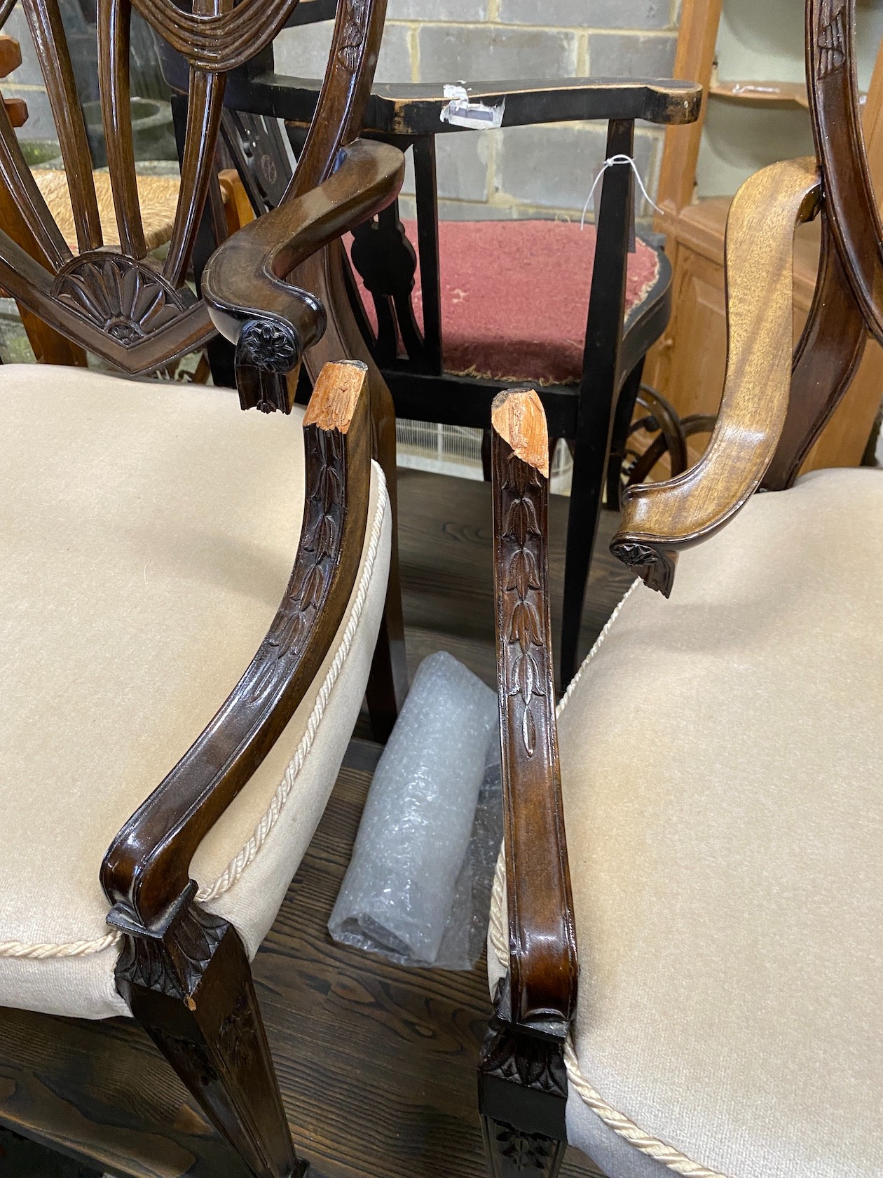 A set of eight Hepplewhite style mahogany dining chairs, two with arms